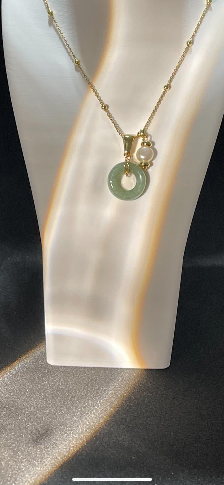 Natural jade necklace photographed with soft signature light reflections